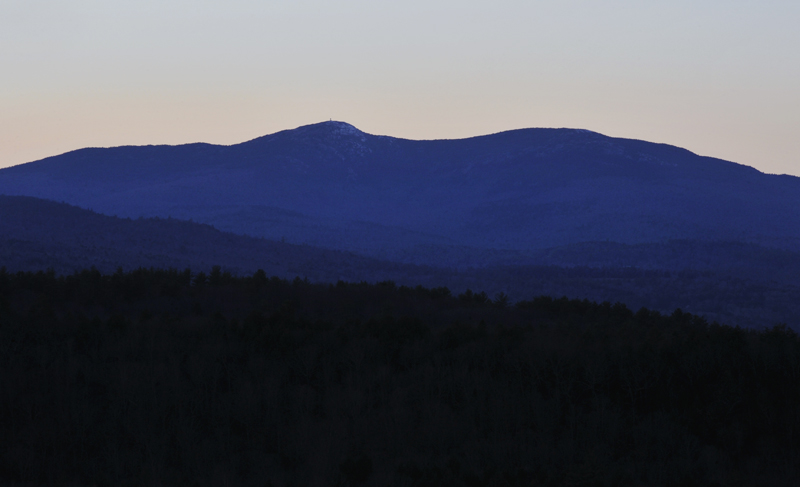 view of mountains from peak in Bristol NH just after sunset